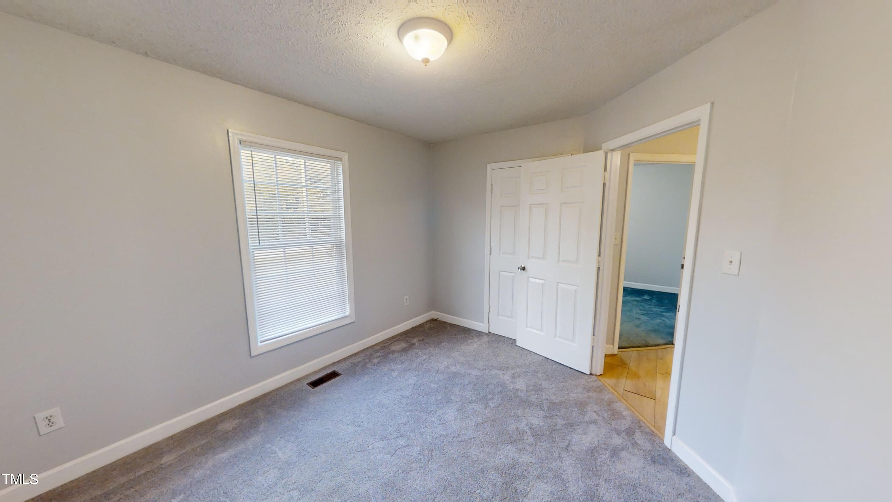 1420 East Lane Street Raleigh, NC 27610 - Photo 16 of 26 an empty room with windows