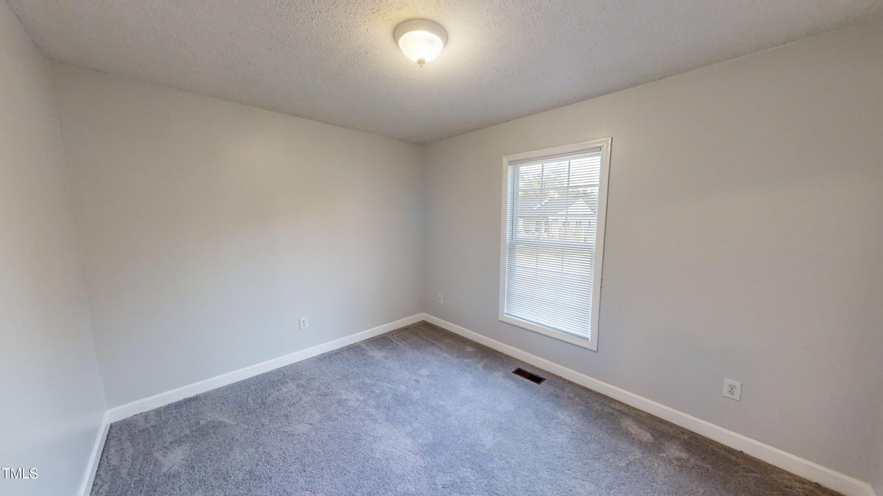 1420 East Lane Street Raleigh, NC 27610 - Photo 20 of 26 an empty room with a window