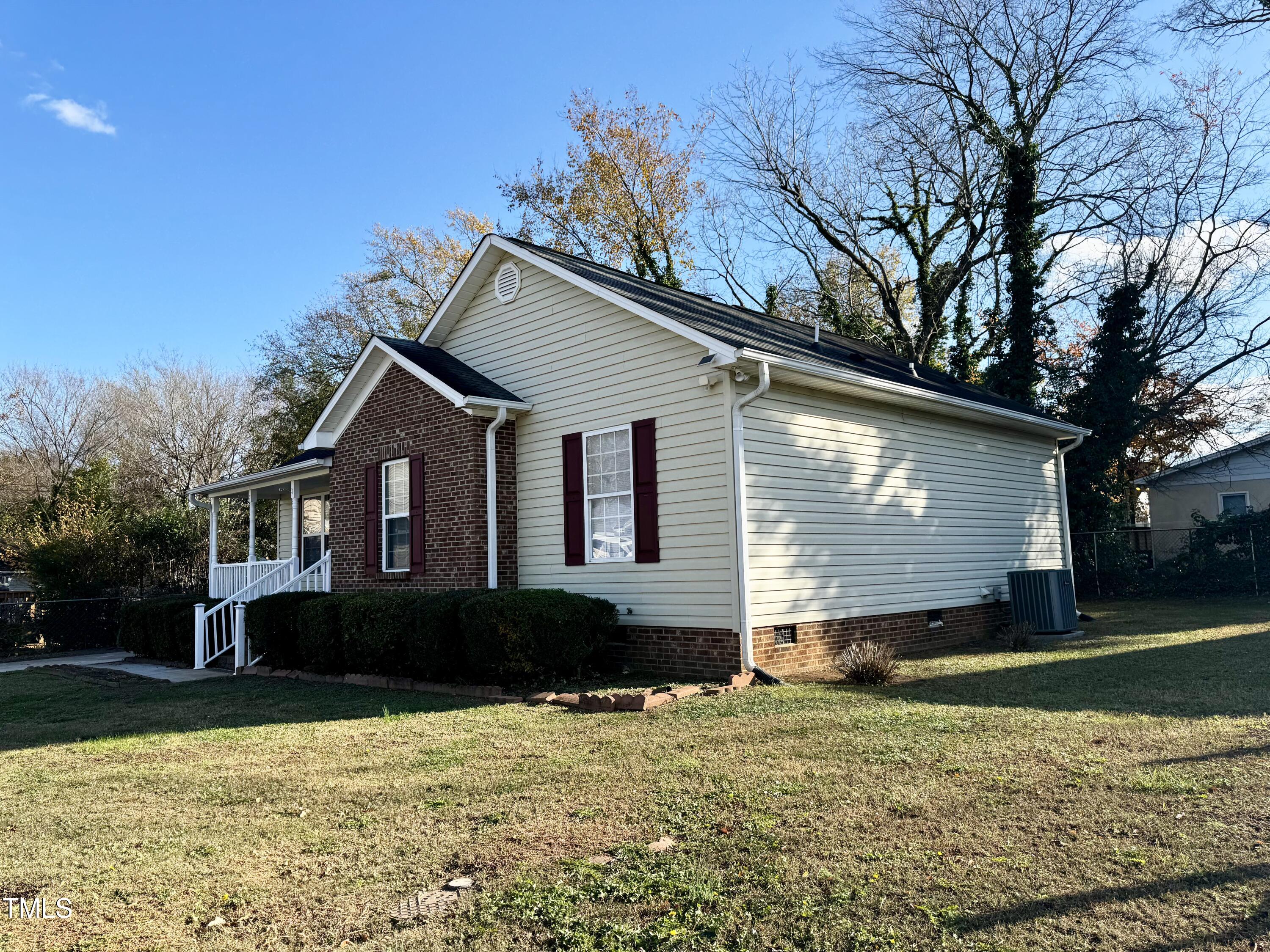 1420 East Lane Street Raleigh, NC 27610 - Photo 2 of 26 a front view of a house with a yard