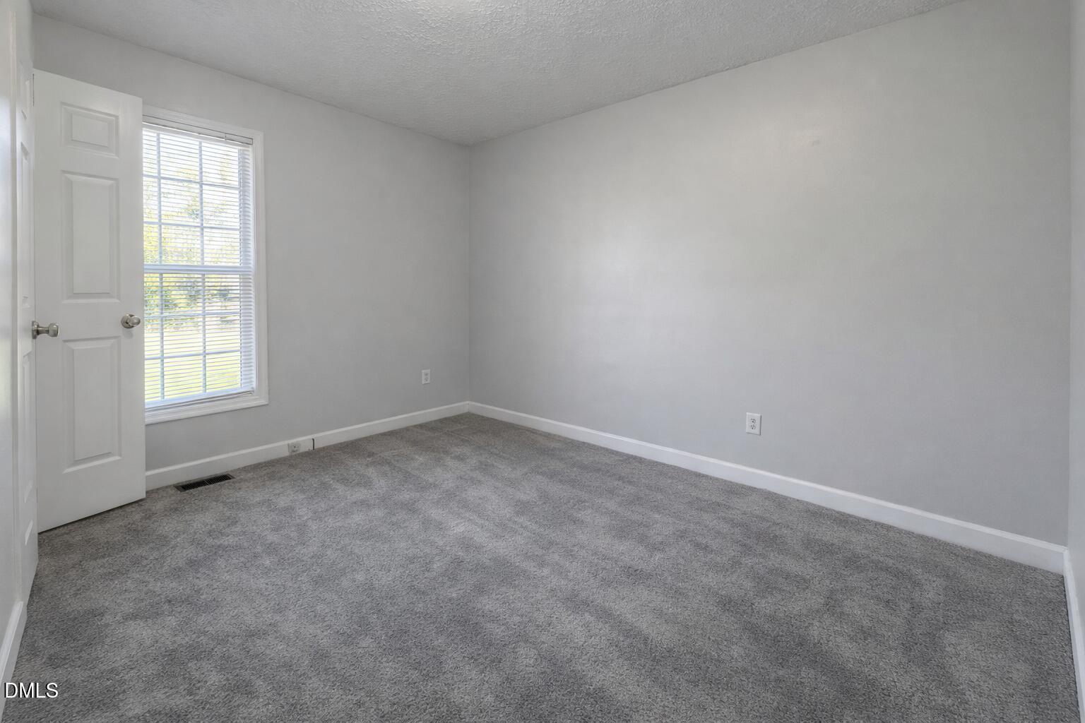 1420 East Lane Street Raleigh, NC 27610 - Photo 21 of 26 an empty room with a window