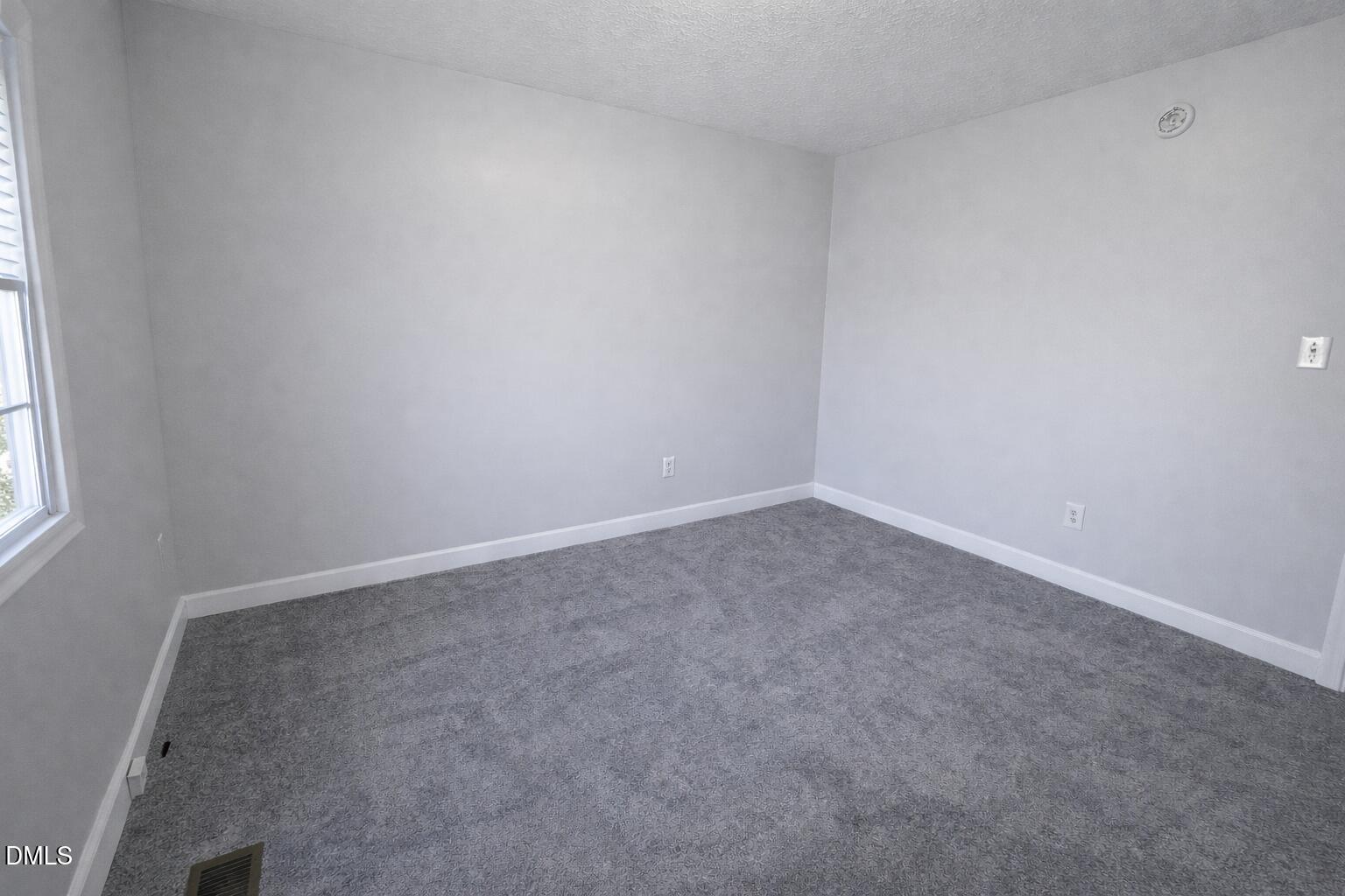 1420 East Lane Street Raleigh, NC 27610 - Photo 22 of 26 an empty room with a window