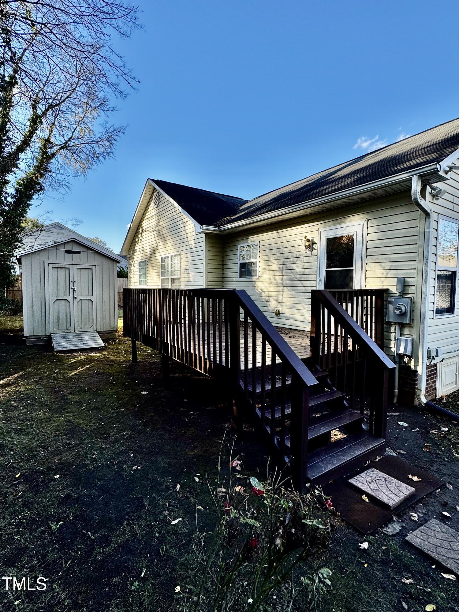 1420 East Lane Street Raleigh, NC 27610 - Photo 25 of 26 a view of a house with a deck