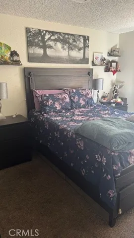 a bedroom with a bed and a table