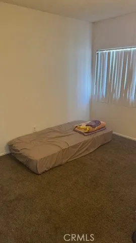 a bed room with two bed and a couch