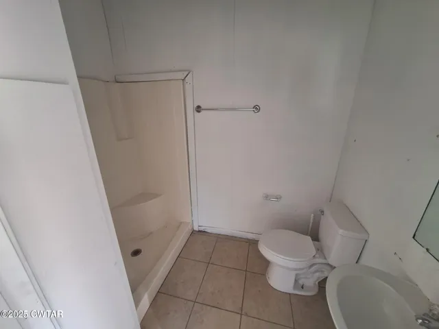 a bathroom with a toilet and a sink