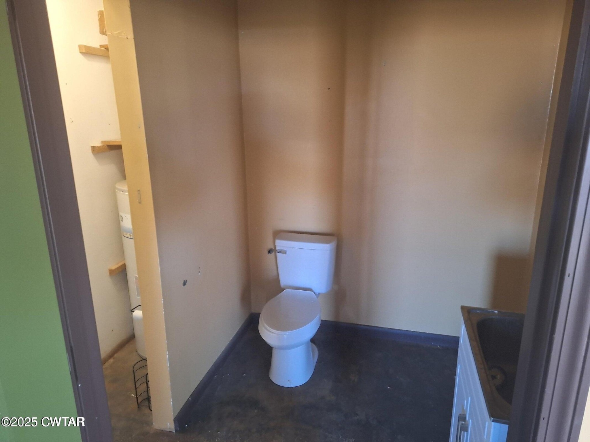 600 Highway 64 Adamsville, TN 38310 - Photo 16 of 25 a bathroom with a toilet and a sink