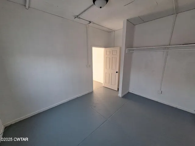 a view of a hallway with staircase