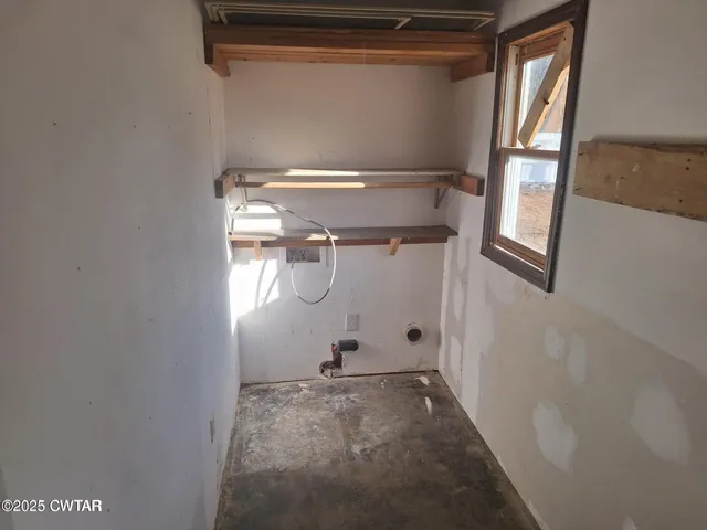 a view of an empty room and a windows