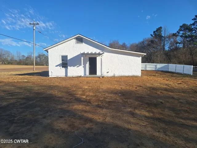a kitchen with a sink and chandelier