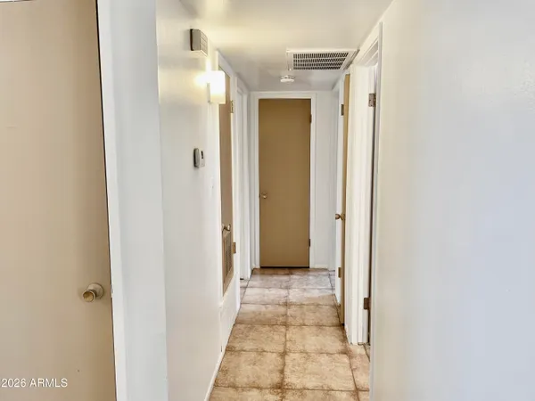 a view of a bathroom with mirror