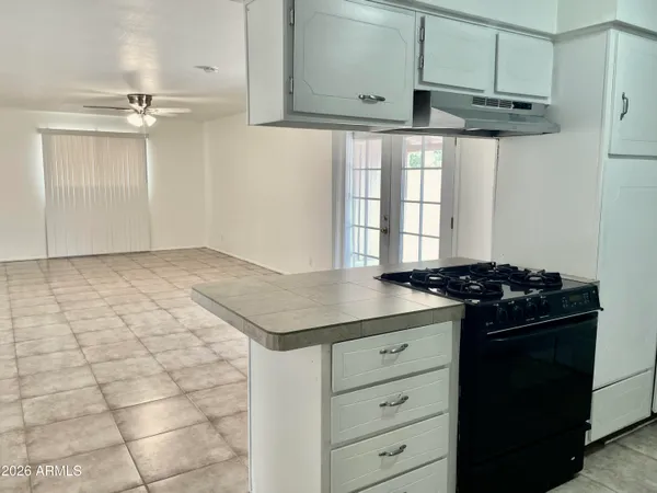 a kitchen with stainless steel appliances a stove and a refrigerator