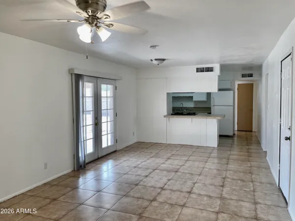a view of a kitchen with a sink and a window