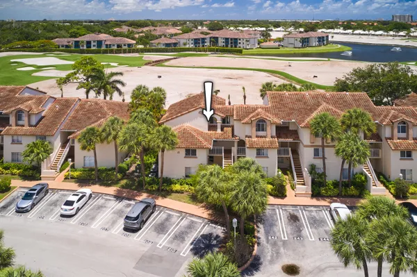 an aerial view of residential houses with outdoor space and swimming pool
