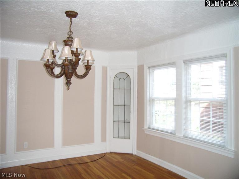 16711 Kenyon Road, Unit DOWN Cleveland, OH 44120 - Photo 4 of 11 The dining room, view of one built-in corner cabinet.