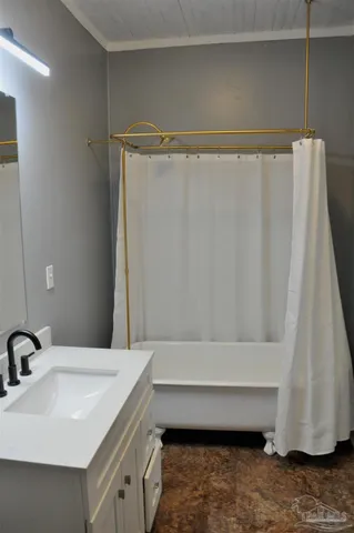 a bathroom with a sink and a mirror