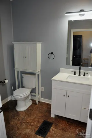a bathroom with a sink toilet and mirror