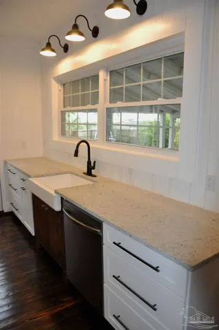a kitchen with a sink and a window