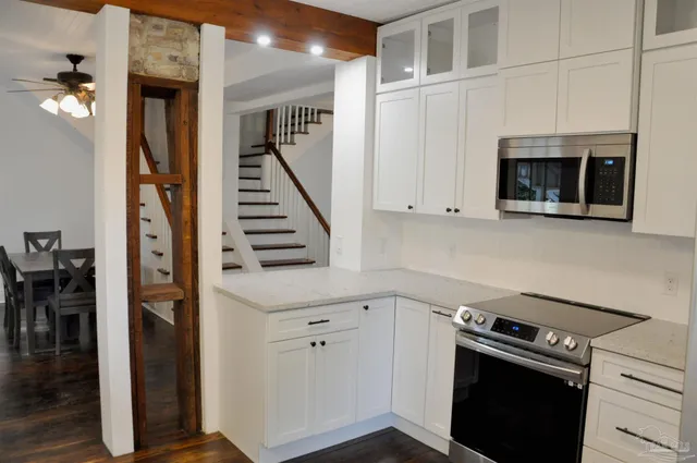 a kitchen with a stove and a microwave