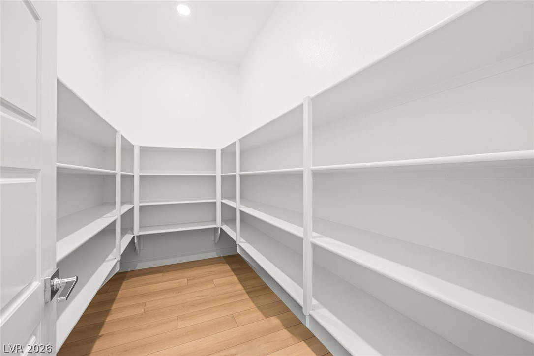 9983 Decano Ridge Street Las Vegas, NV 89141 - Photo 21 of 39 Ample shelving in this well-organized pantry offers generous storage capacity.