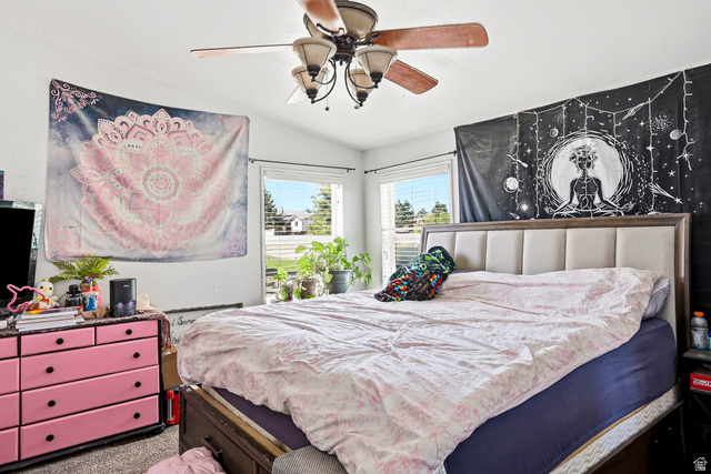 4296 Maple Lane Cedar City, UT 84721 - Photo 15 of 44 Vaulted ceiling bedroom featuring an upholstered headboard, multiple windows, and a ceiling fan with light fixture