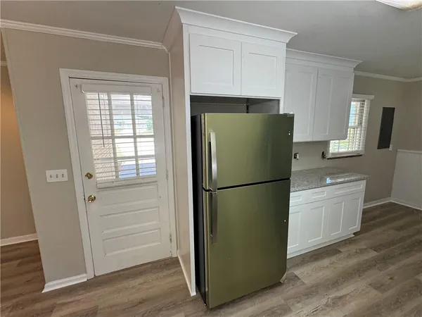 a white refrigerator freezer sitting in a kitchen