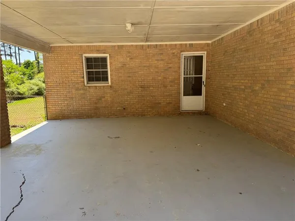 a view of a brick house with a large window