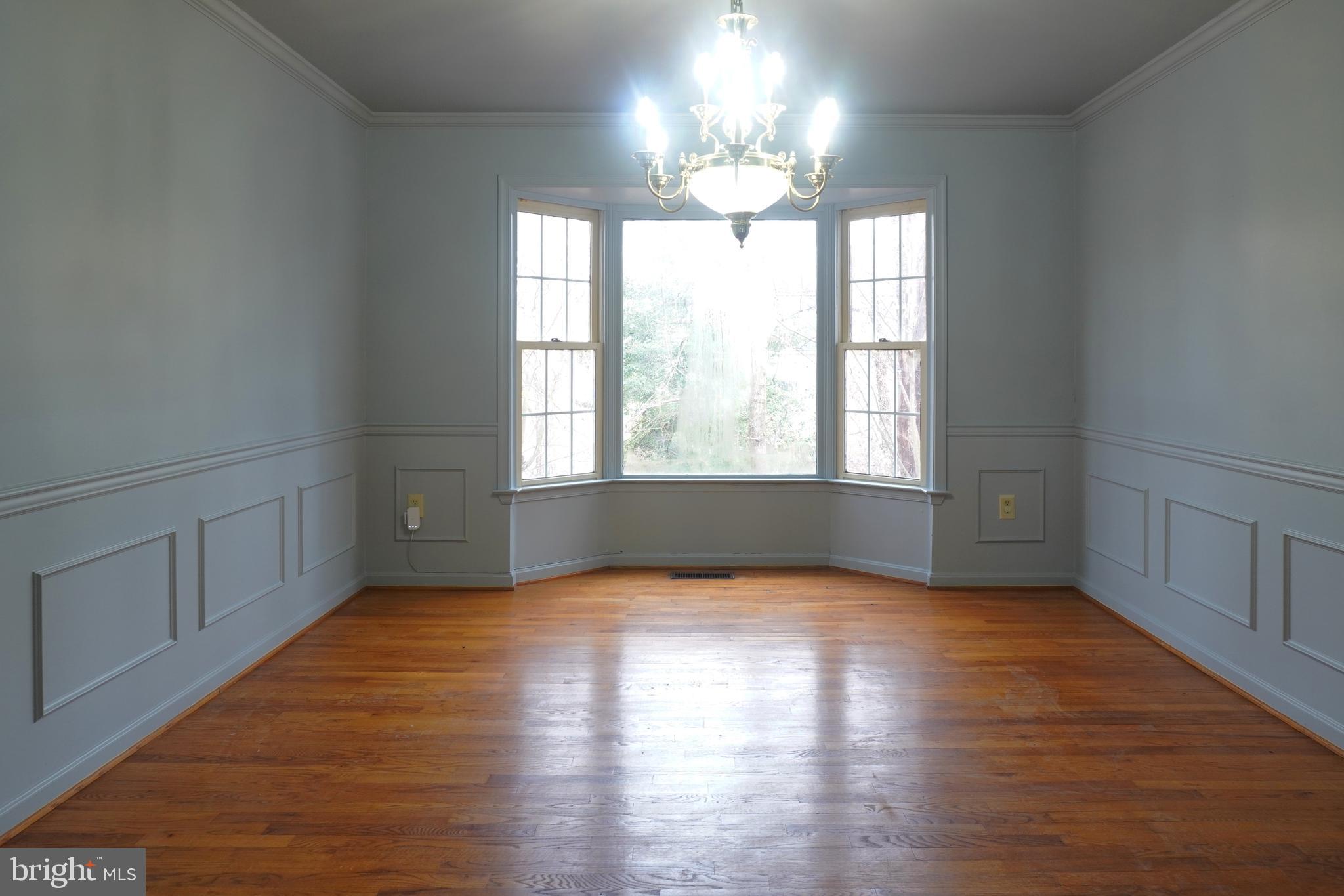 1509 Baytree Terrace Bowie, MD 20721 - Photo 13 of 45 a view of an empty room with wooden floor and a window