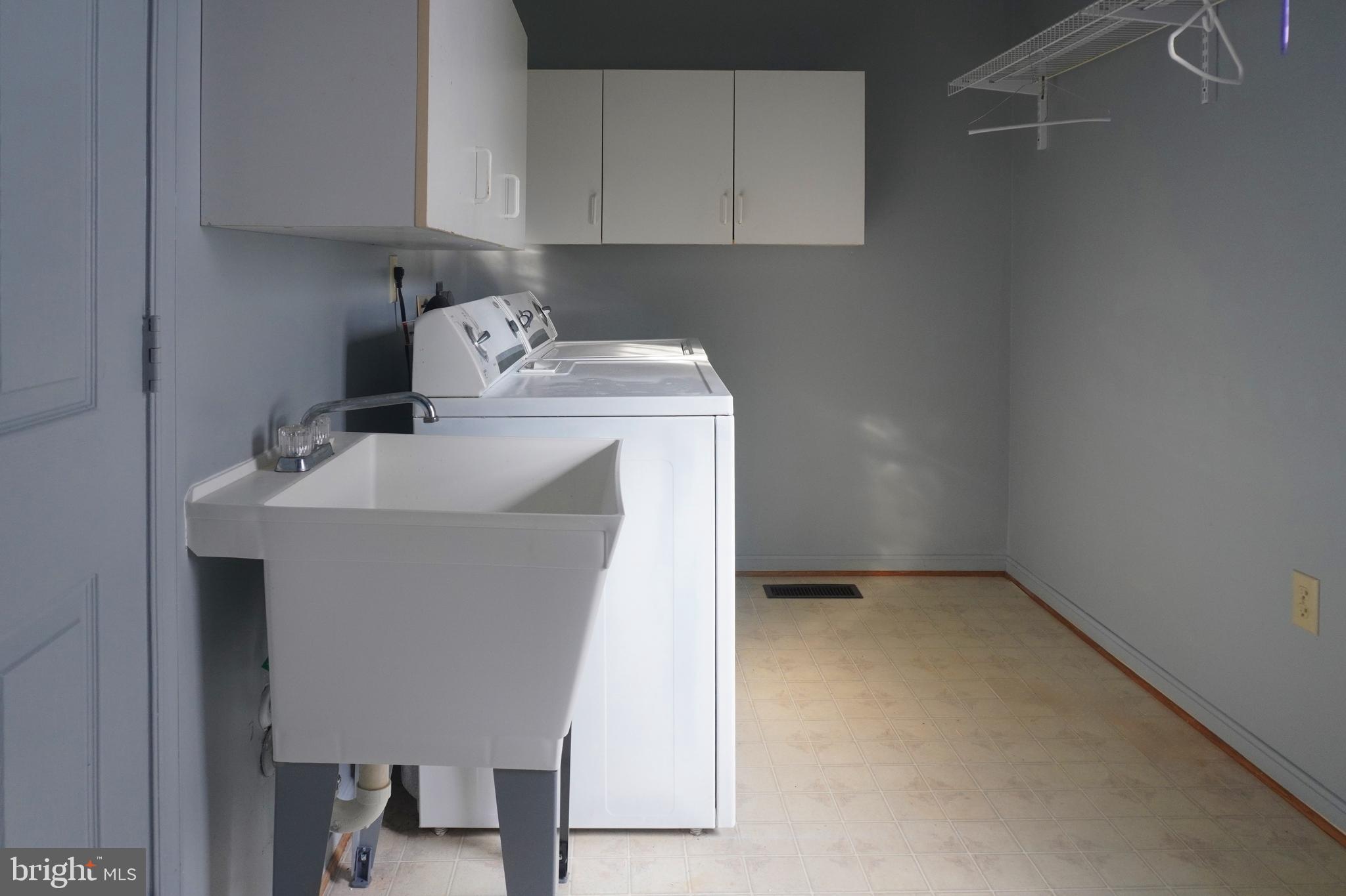 1509 Baytree Terrace Bowie, MD 20721 - Photo 21 of 45 a utility room with sink dryer and washer