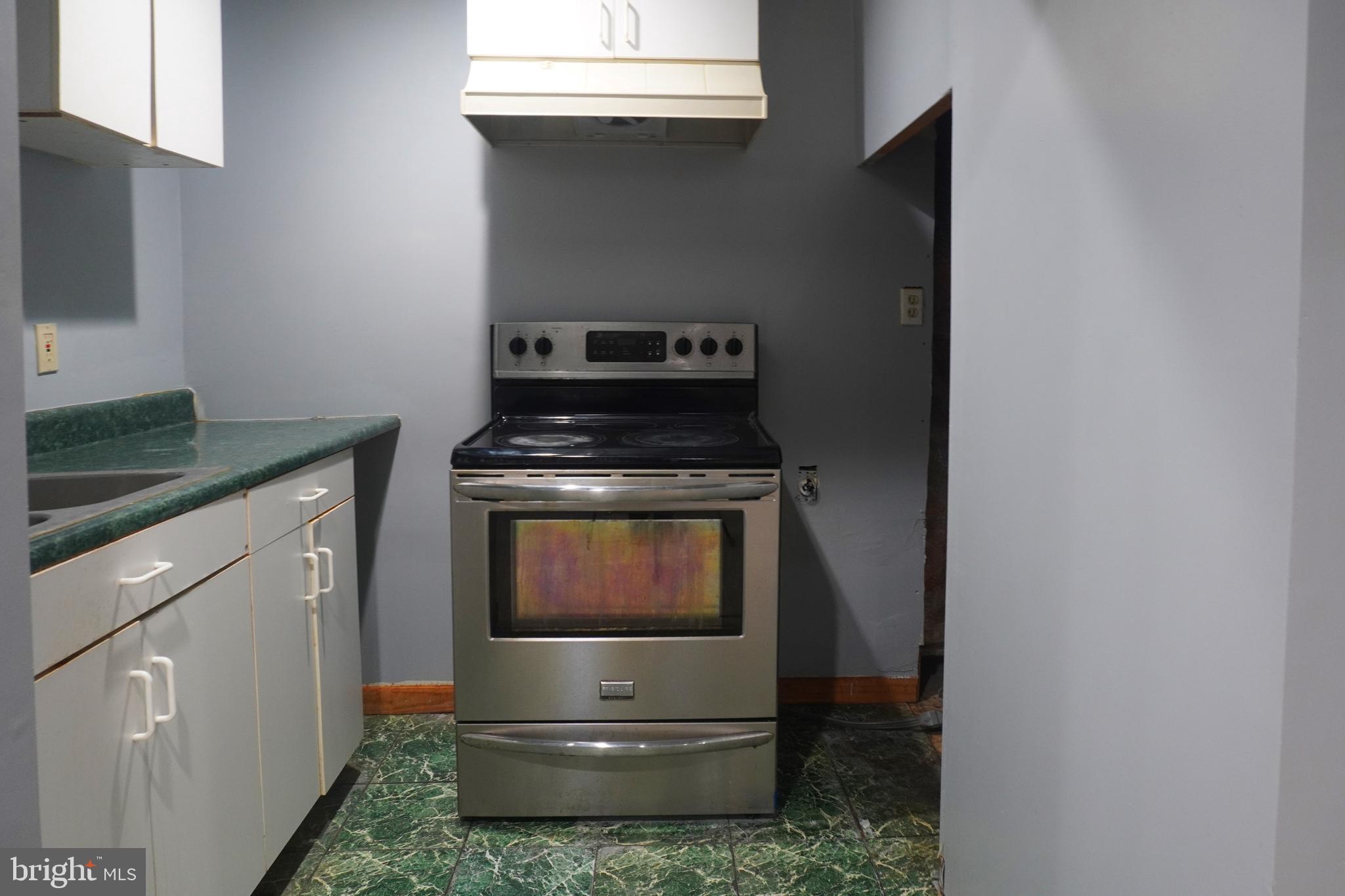 1509 Baytree Terrace Bowie, MD 20721 - Photo 29 of 45 a kitchen with a stove and a microwave