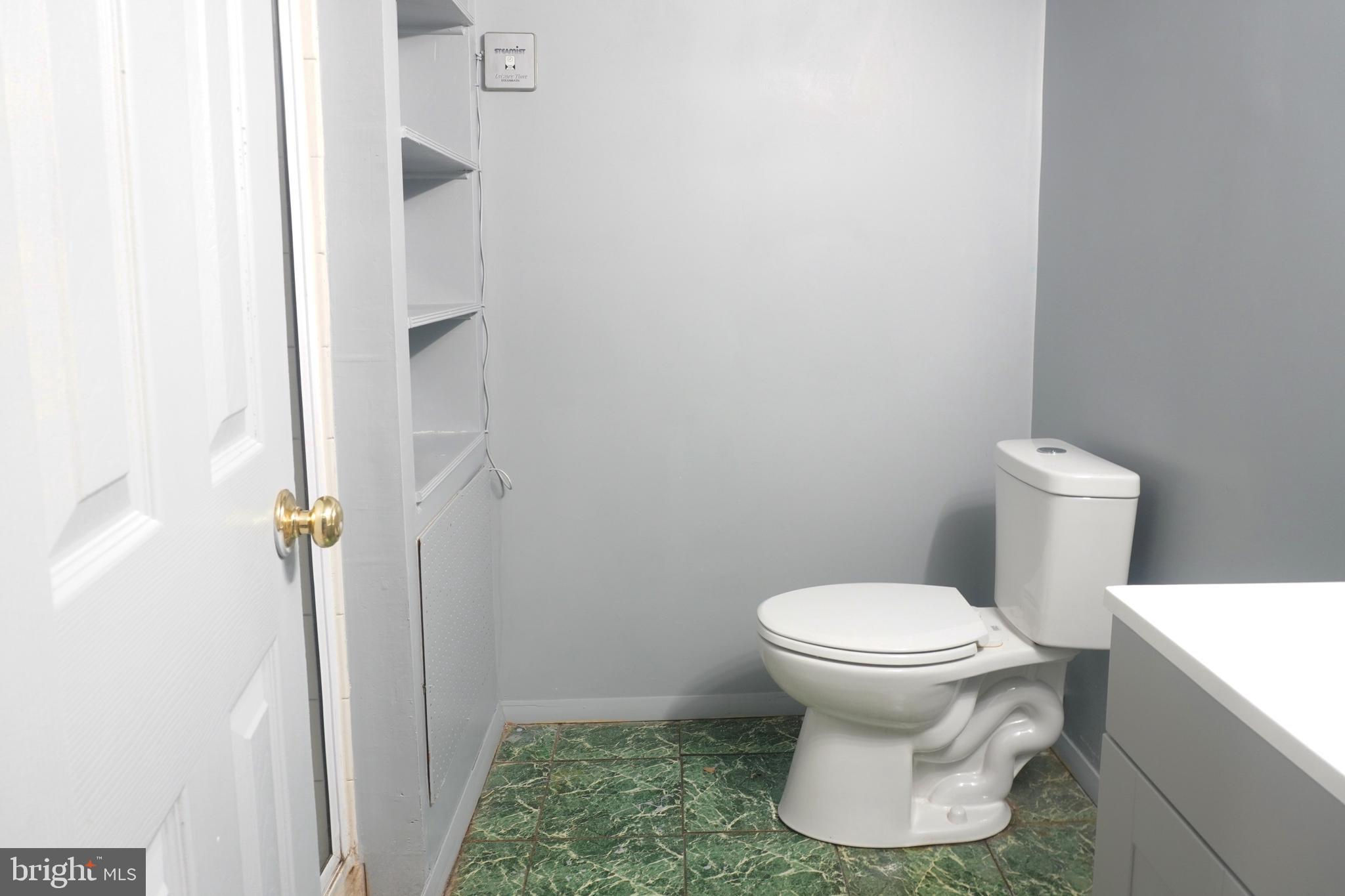 1509 Baytree Terrace Bowie, MD 20721 - Photo 30 of 45 a white toilet sitting next to a white sink