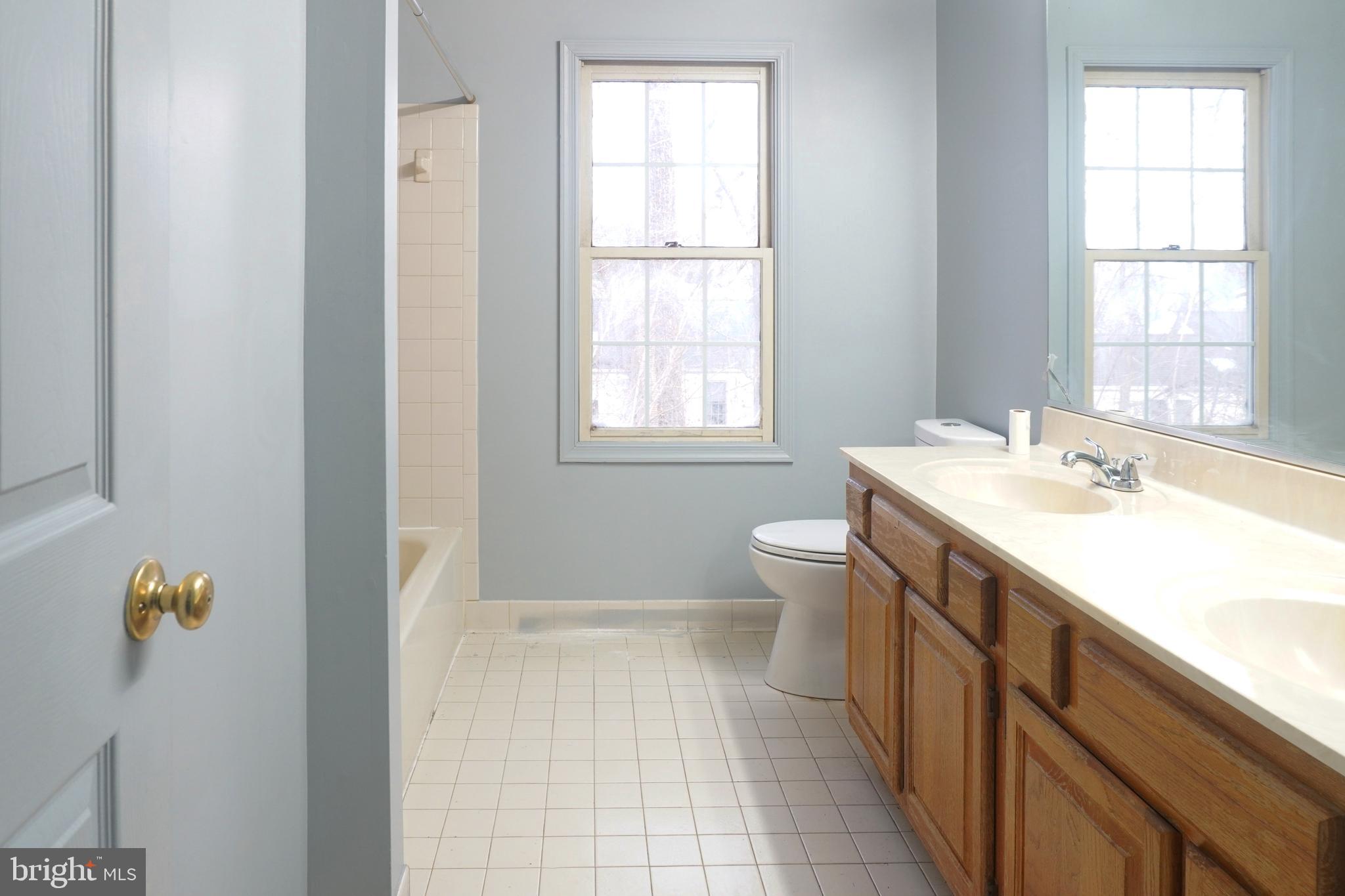 1509 Baytree Terrace Bowie, MD 20721 - Photo 3 of 45 a spacious bathroom with a granite countertop sink toilet and shower