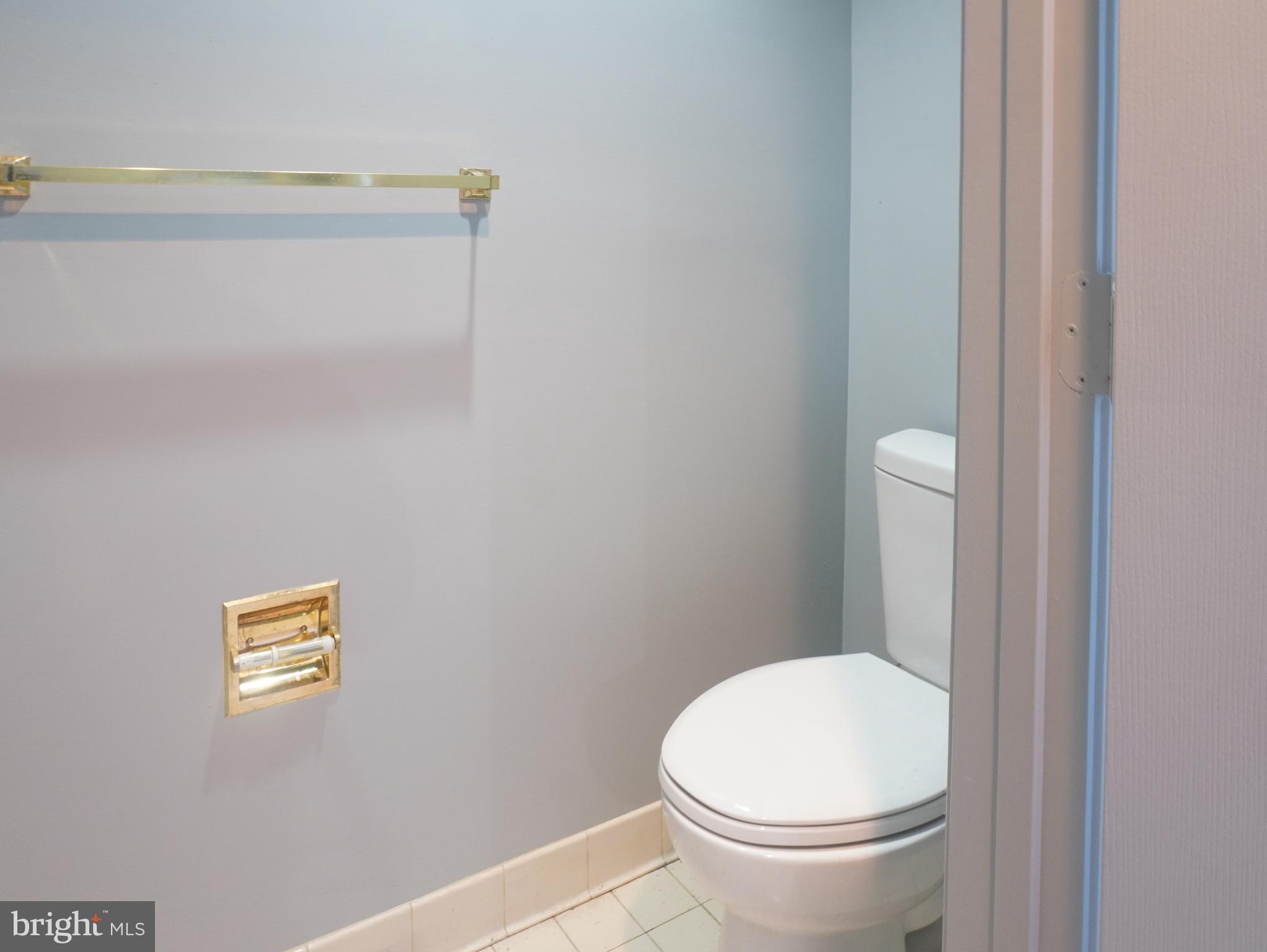1509 Baytree Terrace Bowie, MD 20721 - Photo 5 of 45 a white toilet sitting next to a shower