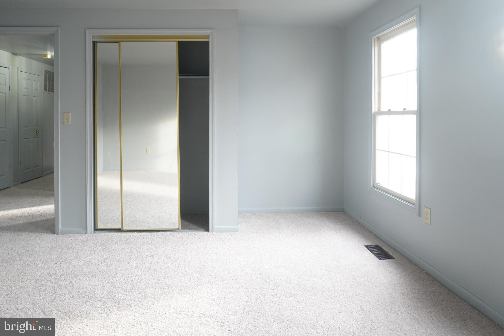 1509 Baytree Terrace Bowie, MD 20721 - Photo 10 of 45 an empty room with windows and closet