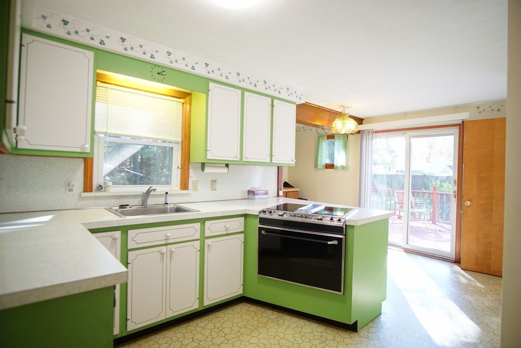 33 Harper Street Springfield, MA 01108 - Photo 5 of 22 a kitchen that has a sink and a stove