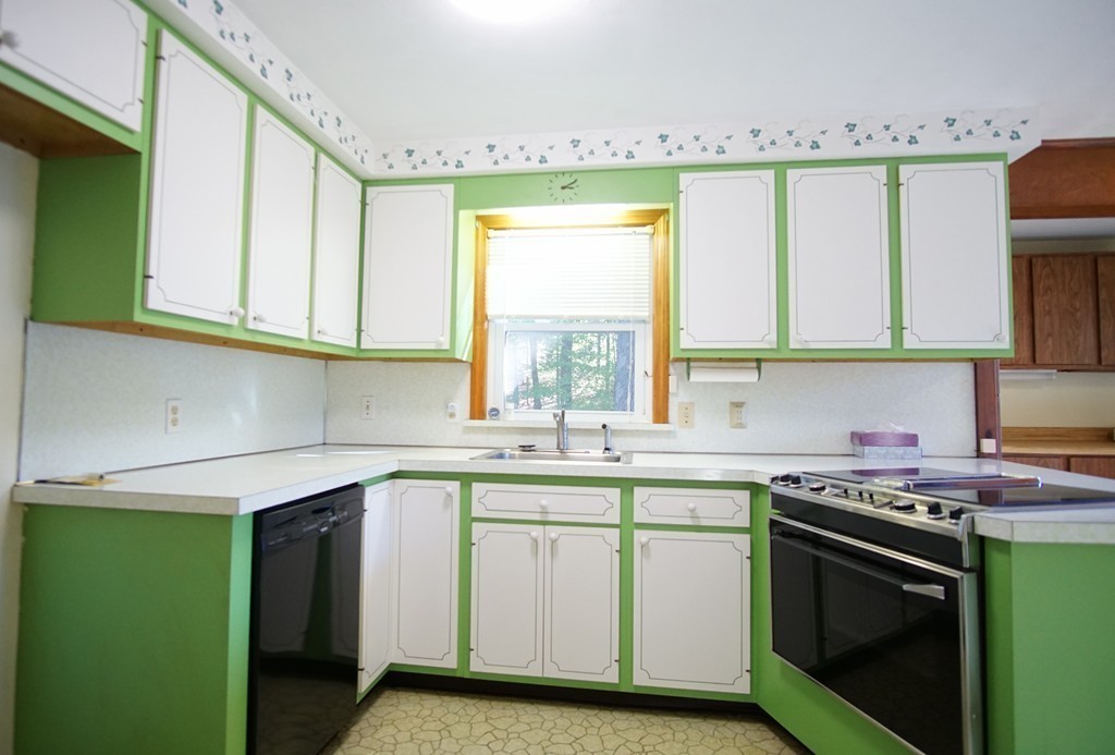 33 Harper Street Springfield, MA 01108 - Photo 6 of 22 a kitchen with a sink stove and cabinets