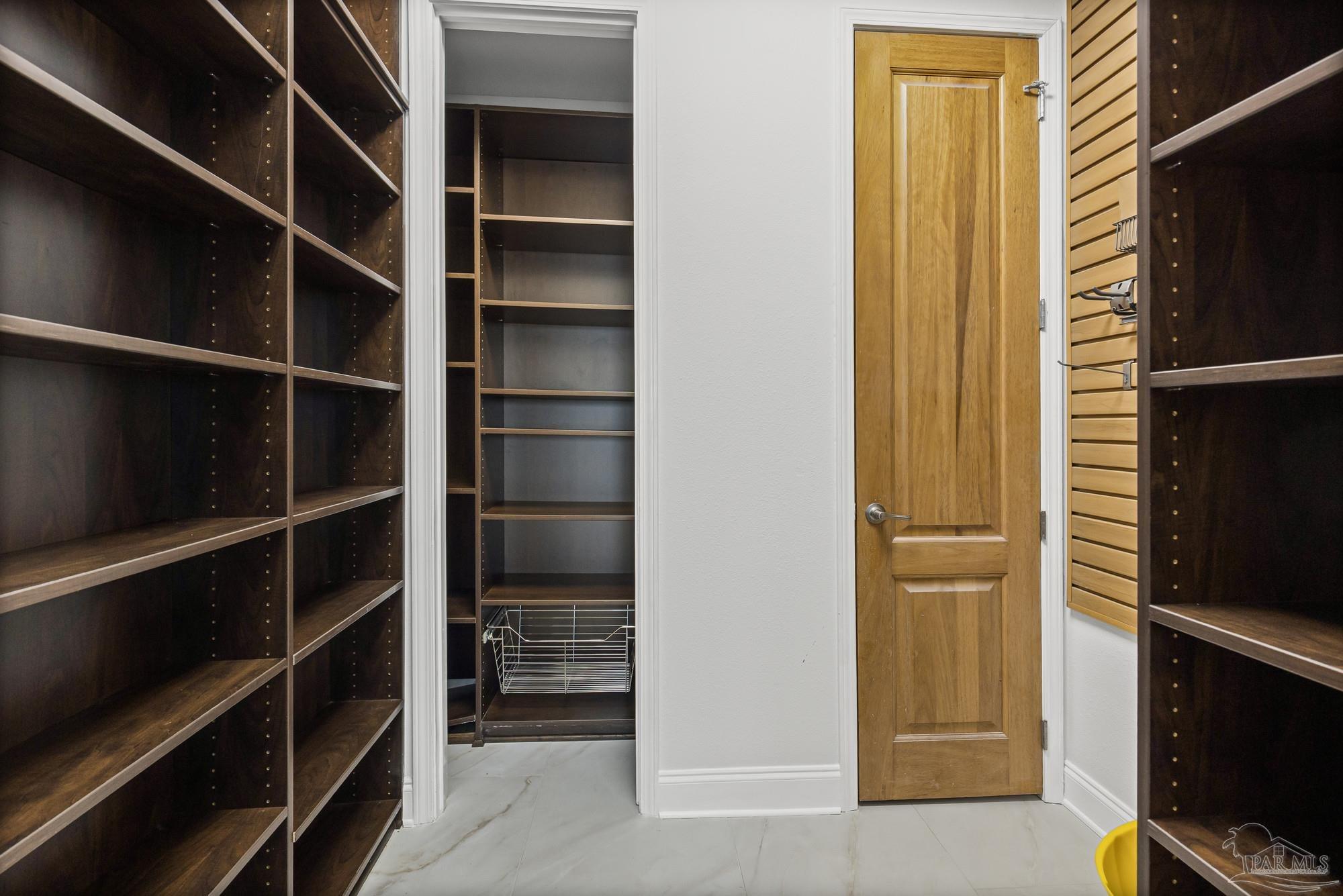 14900 River Road, Unit 904 Perdido Key, FL 32507 - Photo 16 of 62 a view of walk in closet with empty racks