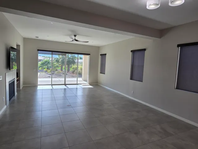 a view of a livingroom with furniture window wooden floor