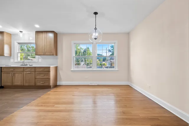 a kitchen with stainless steel appliances granite countertop a stove sink and window
