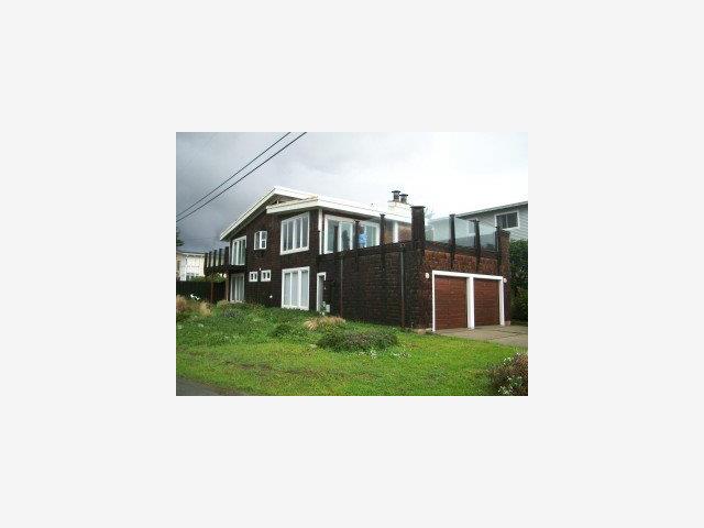 873 Ocean Boulevard Moss Beach, CA 94038 - Photo 1 of 9 a black and white photo of a house