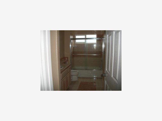 873 Ocean Boulevard Moss Beach, CA 94038 - Photo 3 of 9 a bathroom with a sink and a shower