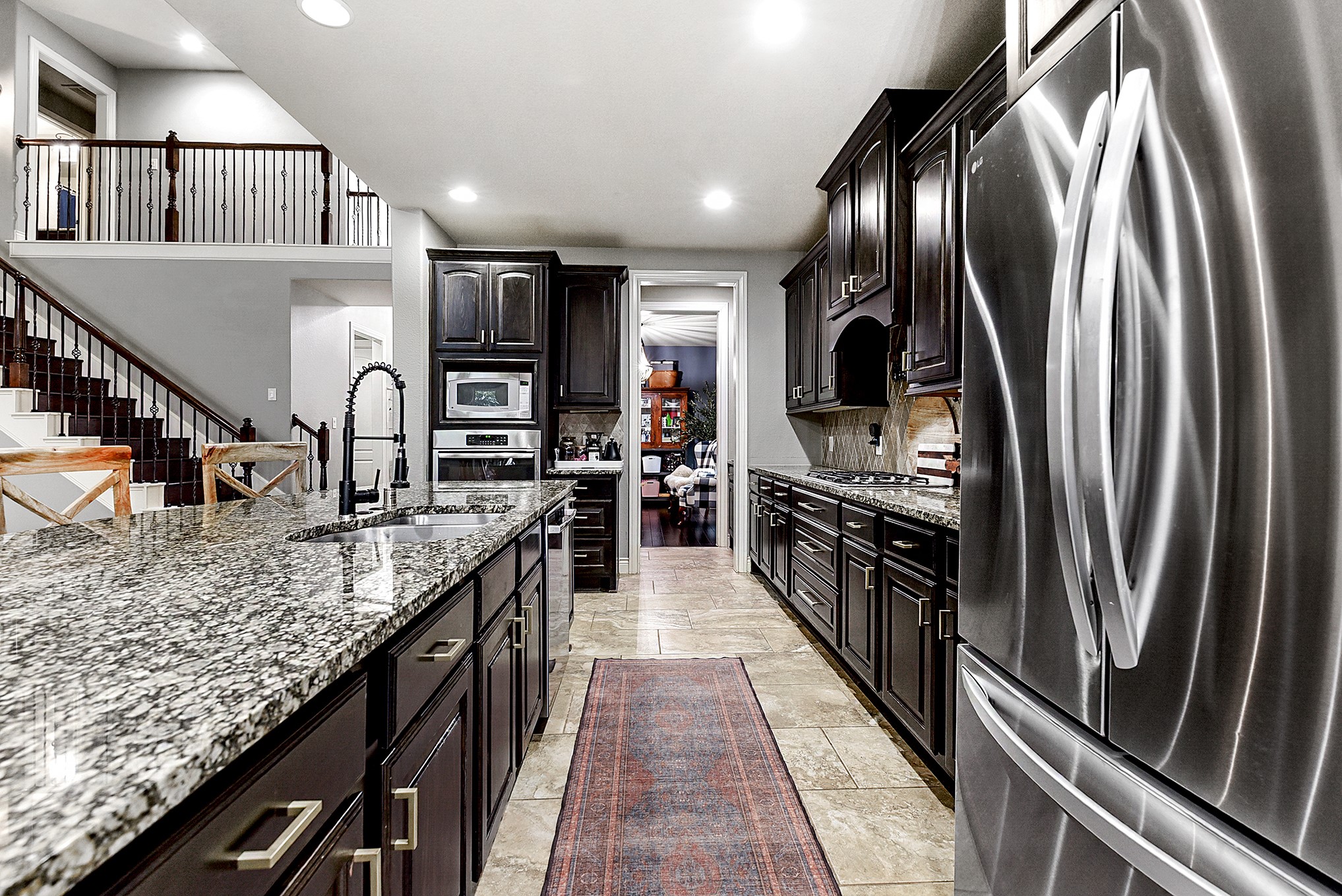 2939 Bobby Jones Road Katy, TX 77494 - Photo 16 of 50 a kitchen with stainless steel appliances granite countertop a refrigerator a stove and a sink