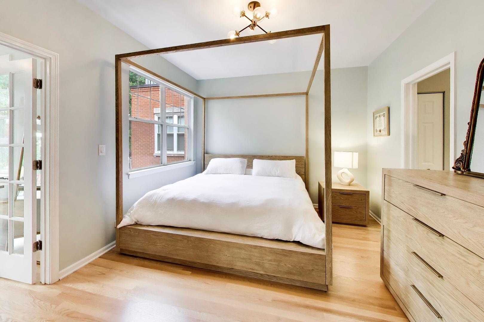 232 West Scott Street Chicago, IL 60610 - Photo 11 of 39 a spacious bedroom with a large bed and a dresser