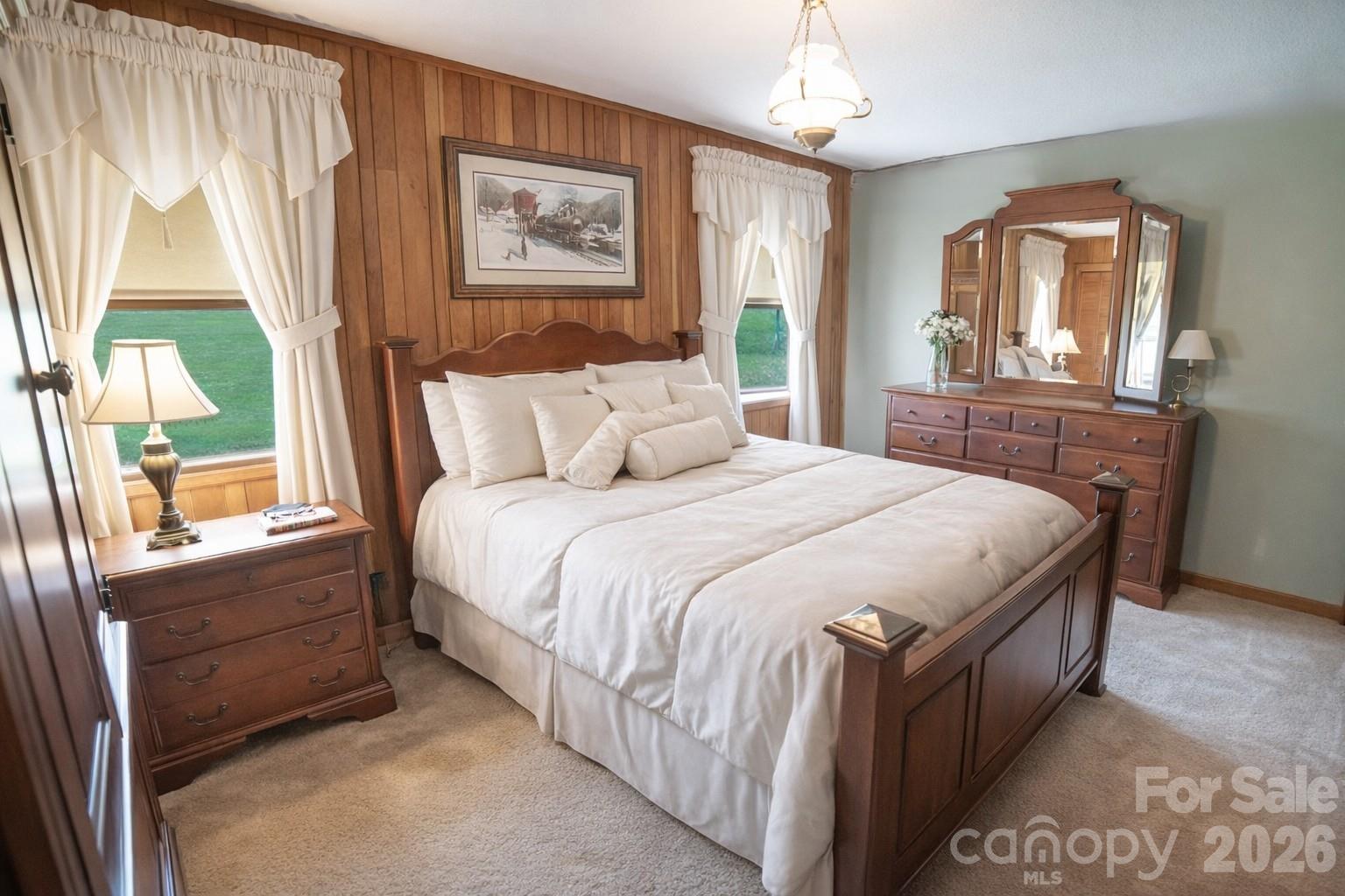 1368 Cajah Mountain Road Hudson, NC 28638 - Photo 20 of 39 a bedroom with a large bed and a window