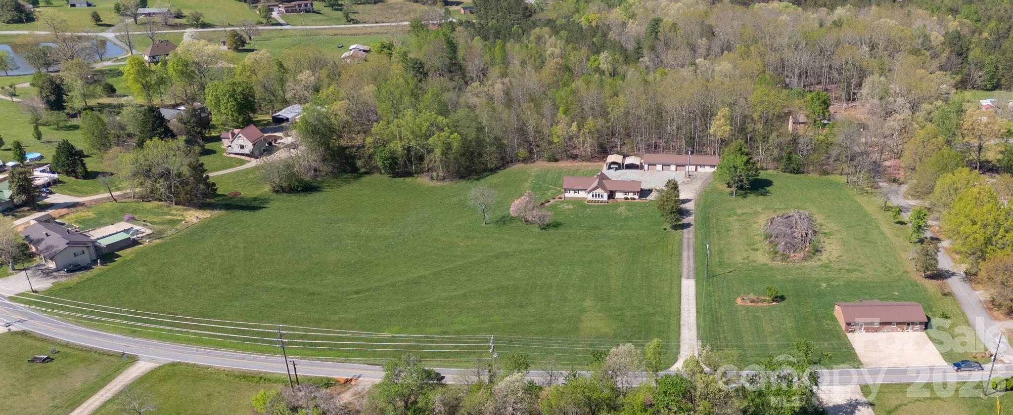 1368 Cajah Mountain Road Hudson, NC 28638 - Photo 2 of 39 an aerial view of a house with a yard basket ball court and outdoor seating