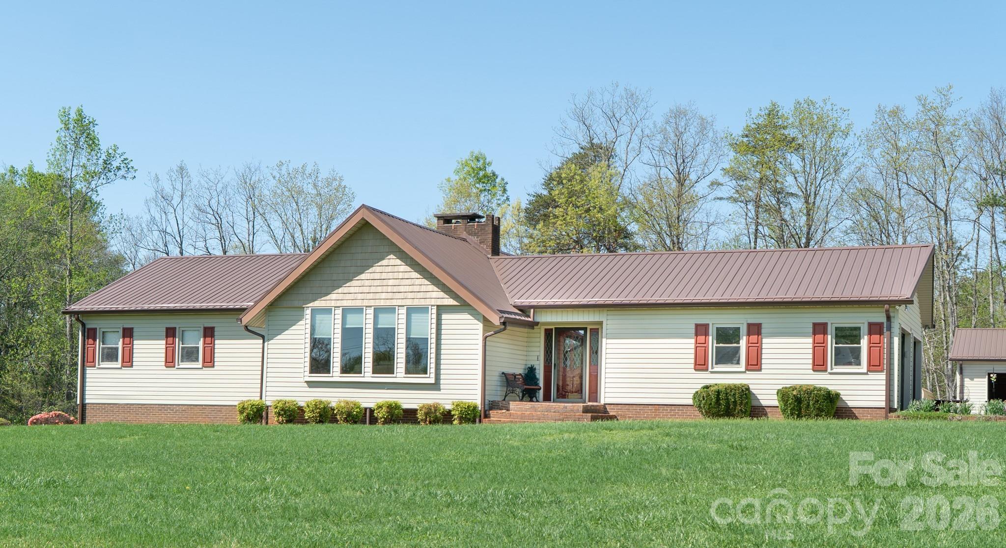 1368 Cajah Mountain Road Hudson, NC 28638 - Photo 3 of 39 a front view of a house with a yard