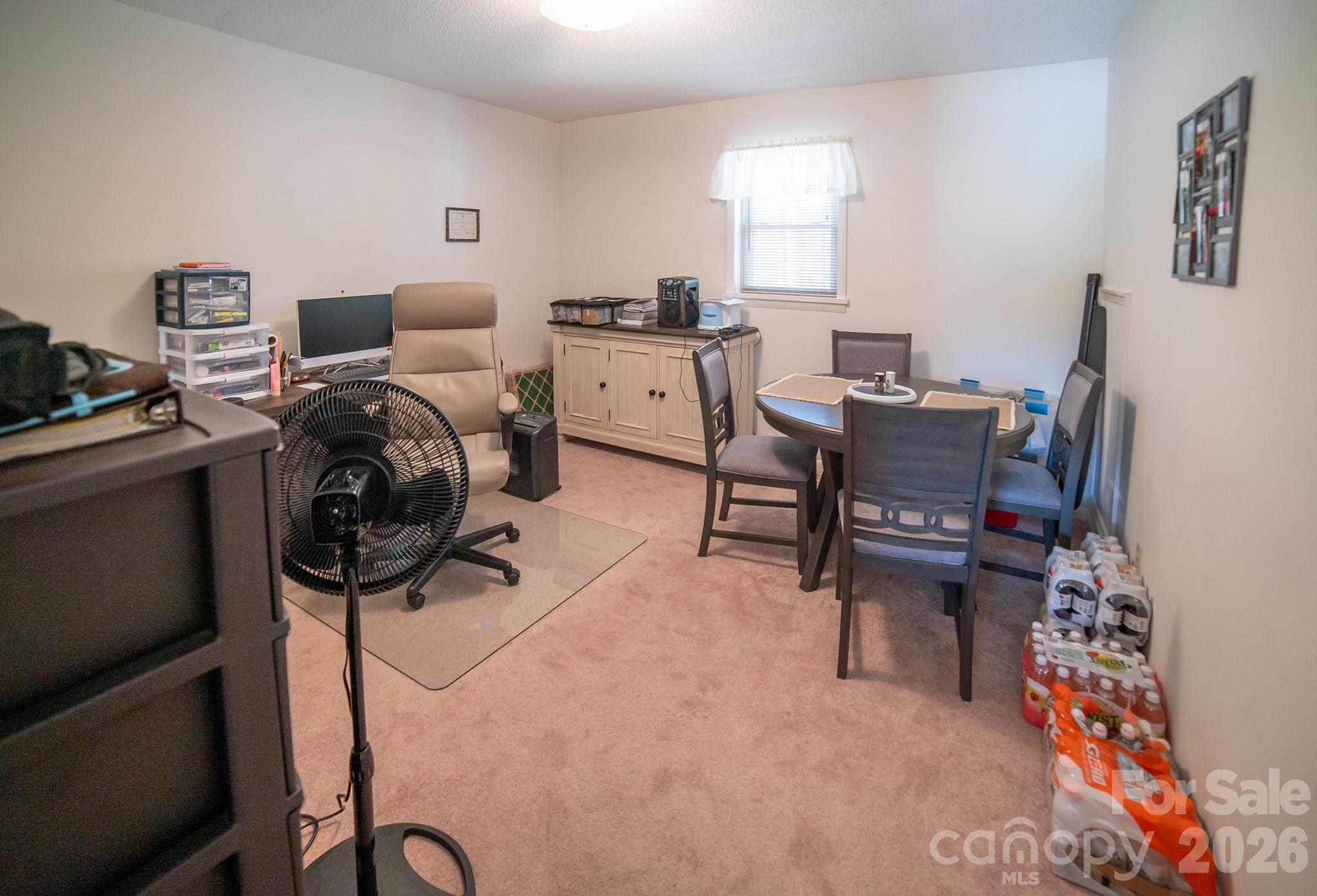 1368 Cajah Mountain Road Hudson, NC 28638 - Photo 34 of 39 a room with furniture a rug and a window