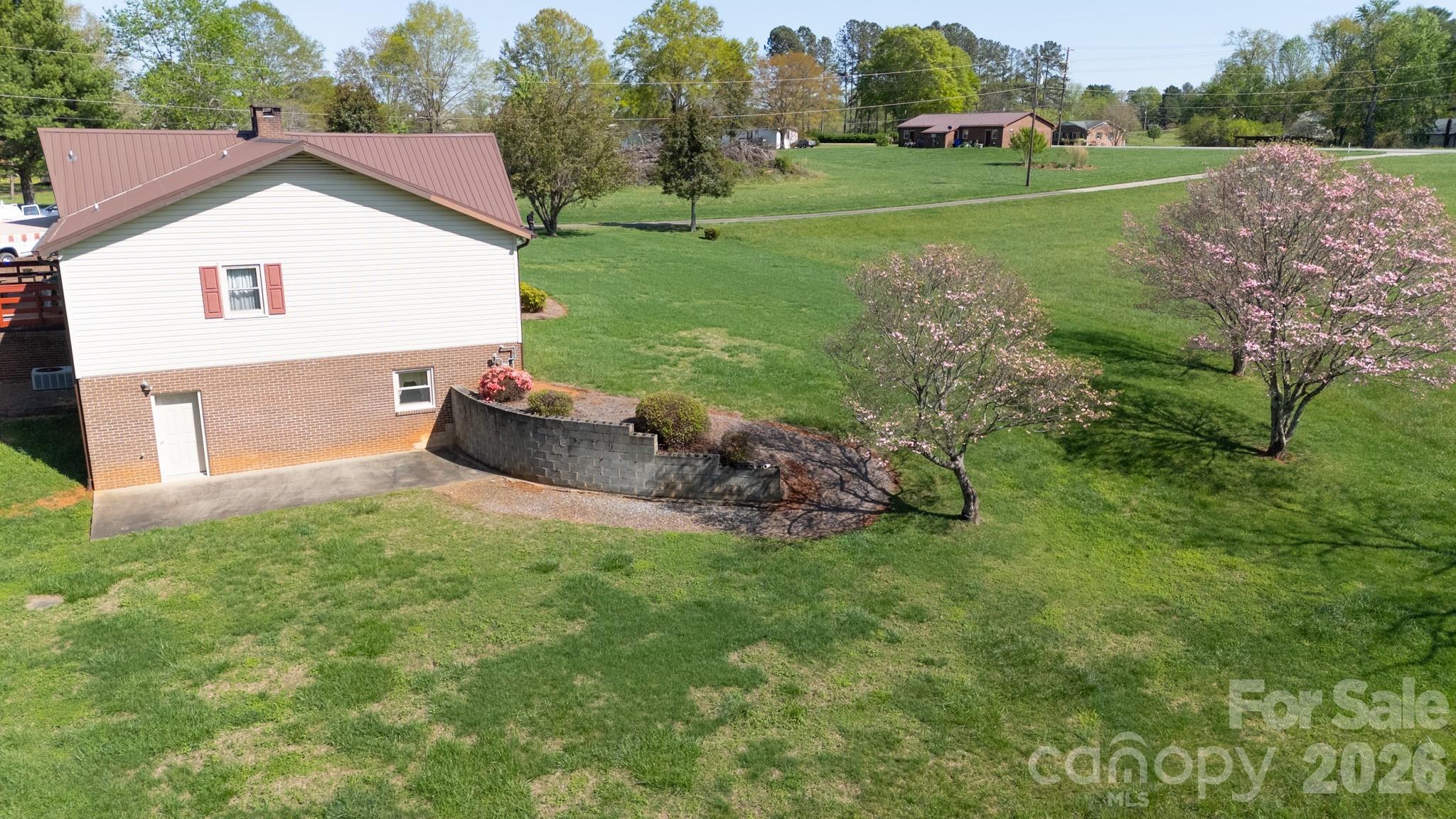 1368 Cajah Mountain Road Hudson, NC 28638 - Photo 35 of 39 a front view of a house with garden