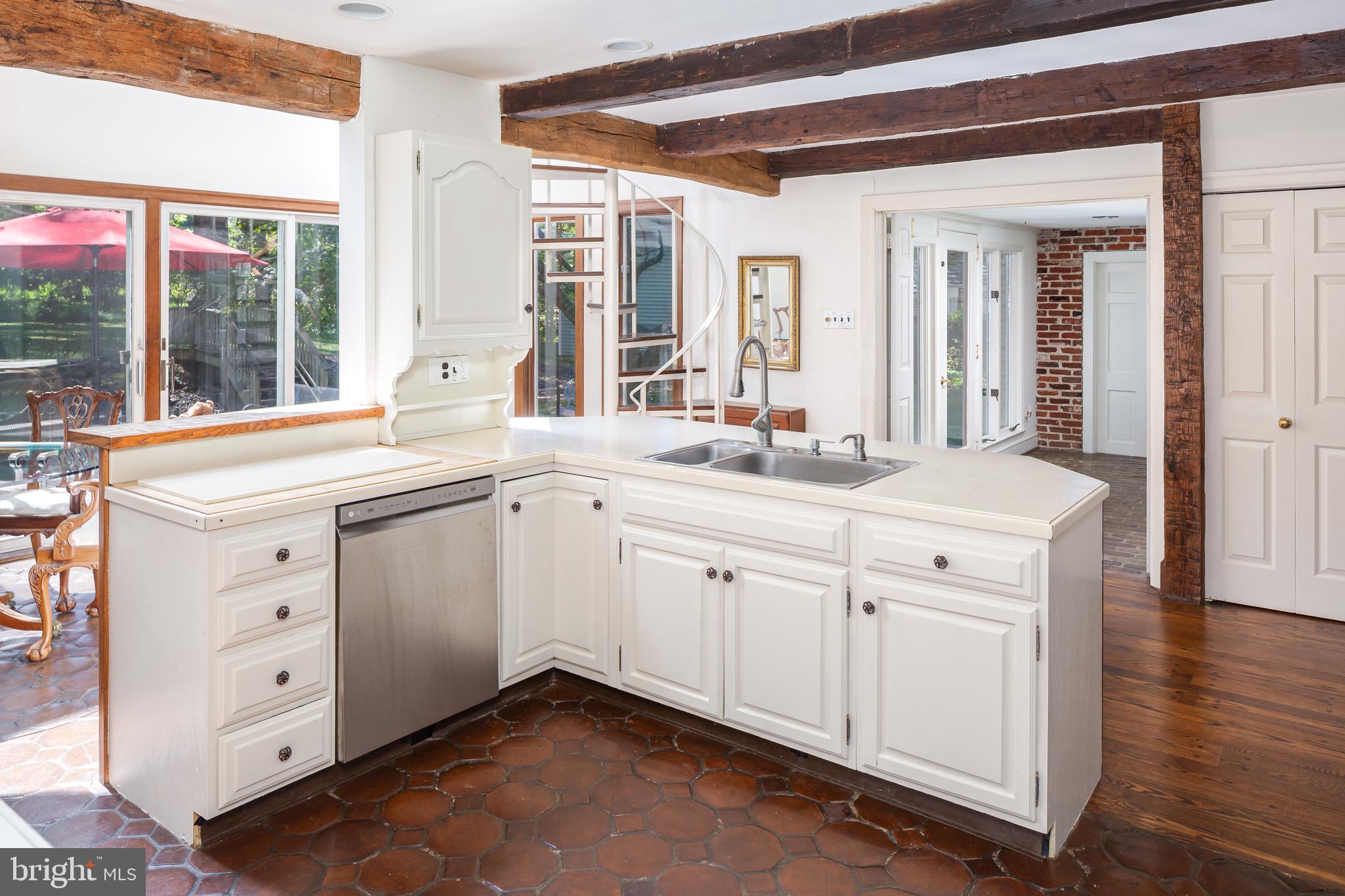 8 Fox Chase Road Malvern, PA 19355 - Photo 13 of 49 a white kitchen with a sink and dish washer
