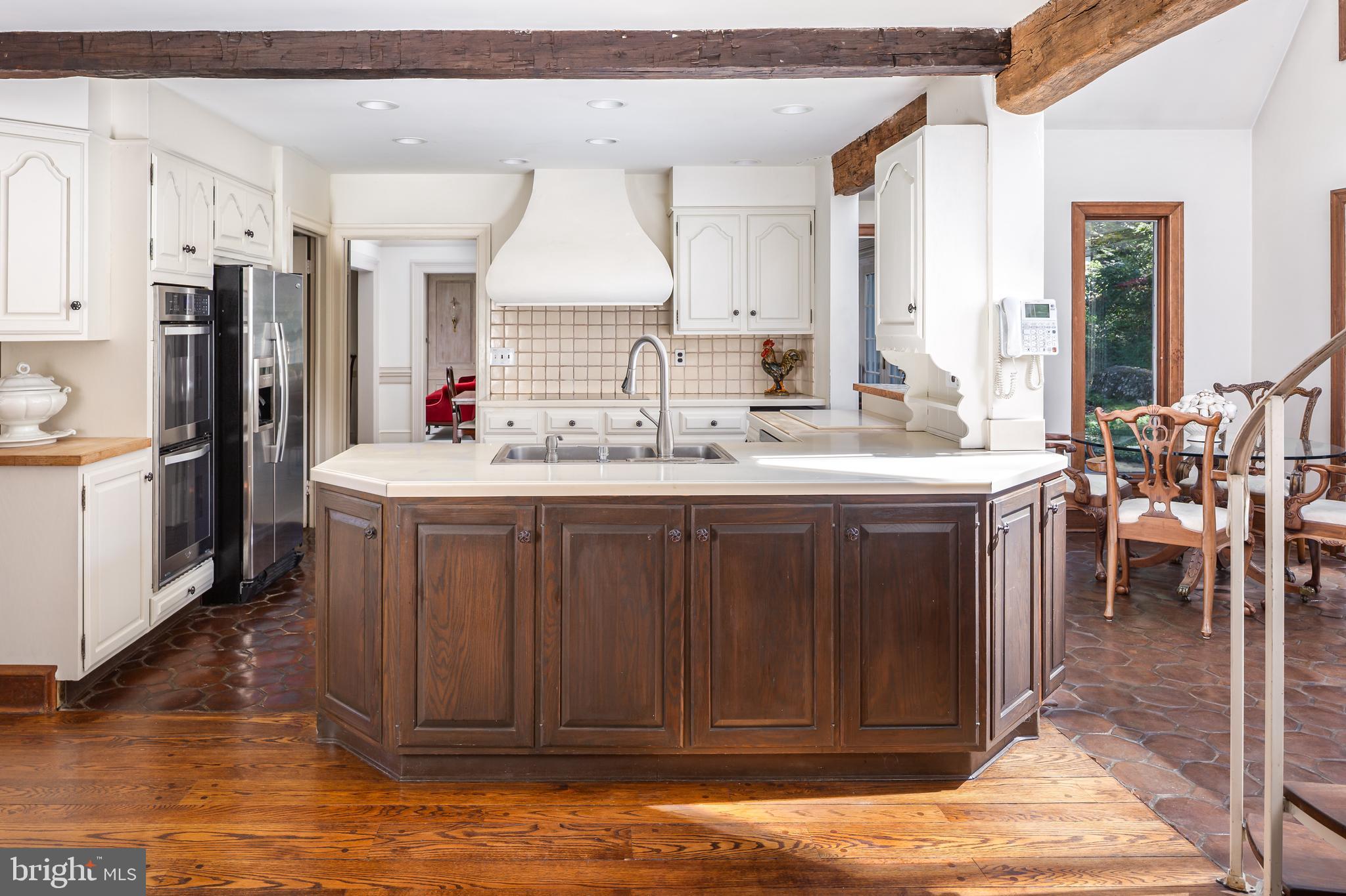 8 Fox Chase Road Malvern, PA 19355 - Photo 14 of 49 a kitchen with stainless steel appliances granite countertop a sink stove and refrigerator