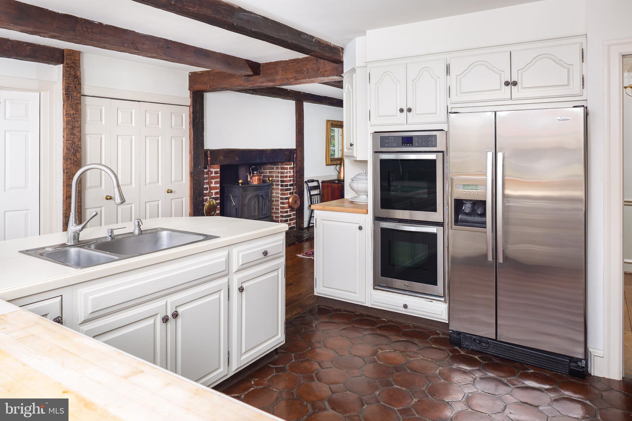 8 Fox Chase Road Malvern, PA 19355 - Photo 16 of 49 a kitchen with stainless steel appliances a refrigerator sink and cabinets